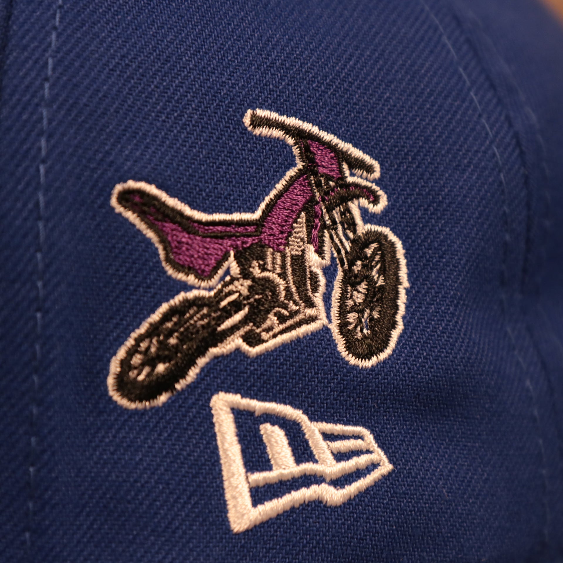 Motorcycle side patch of the Philadelphia 76ers City Transit All Over Side Patch Gray Bottom 59Fifty Fitted Cap