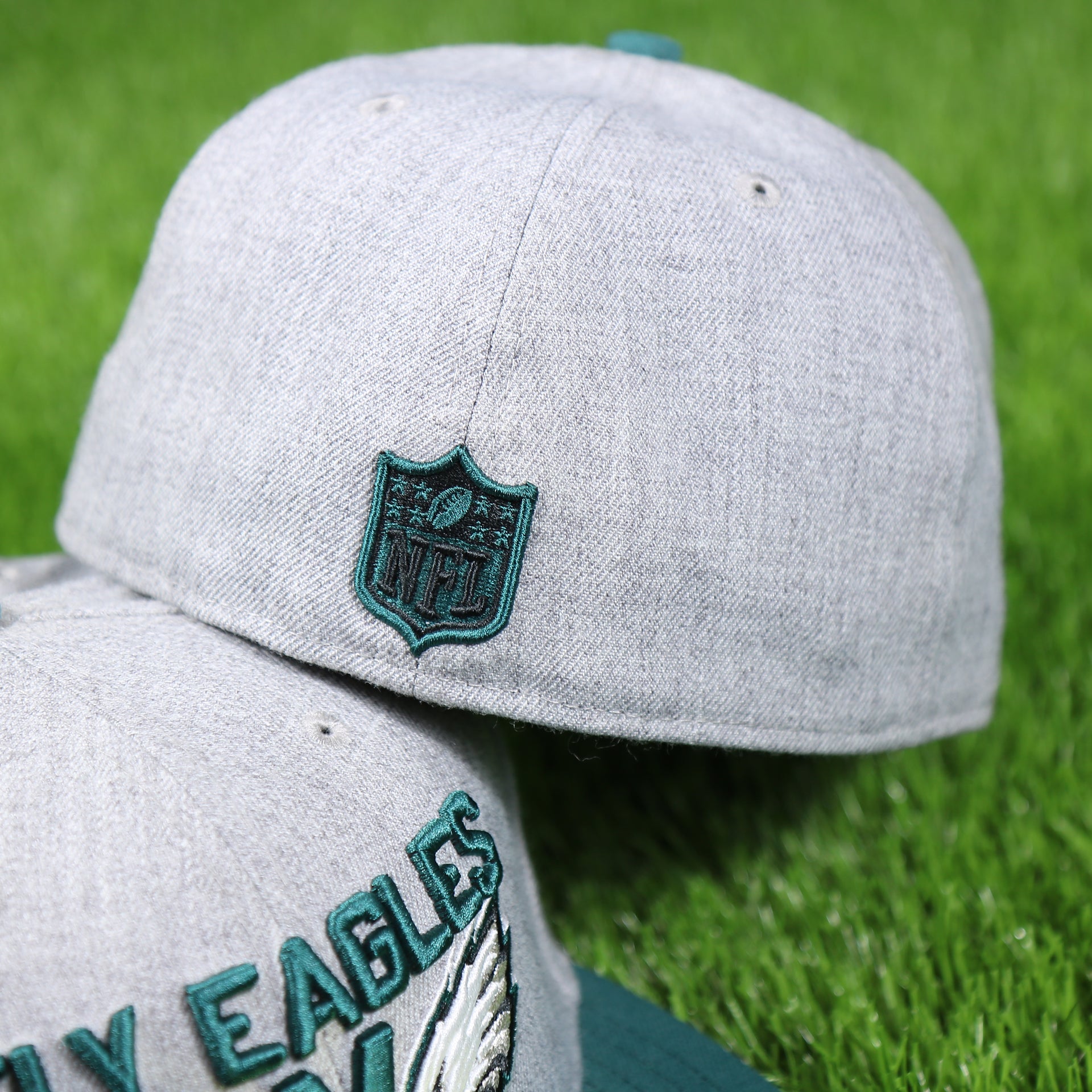 nfl shield on the back side of the Philadelphia Eagles 2018 On-Stage Draft 59Fifty Green Bottom Fitted Cap