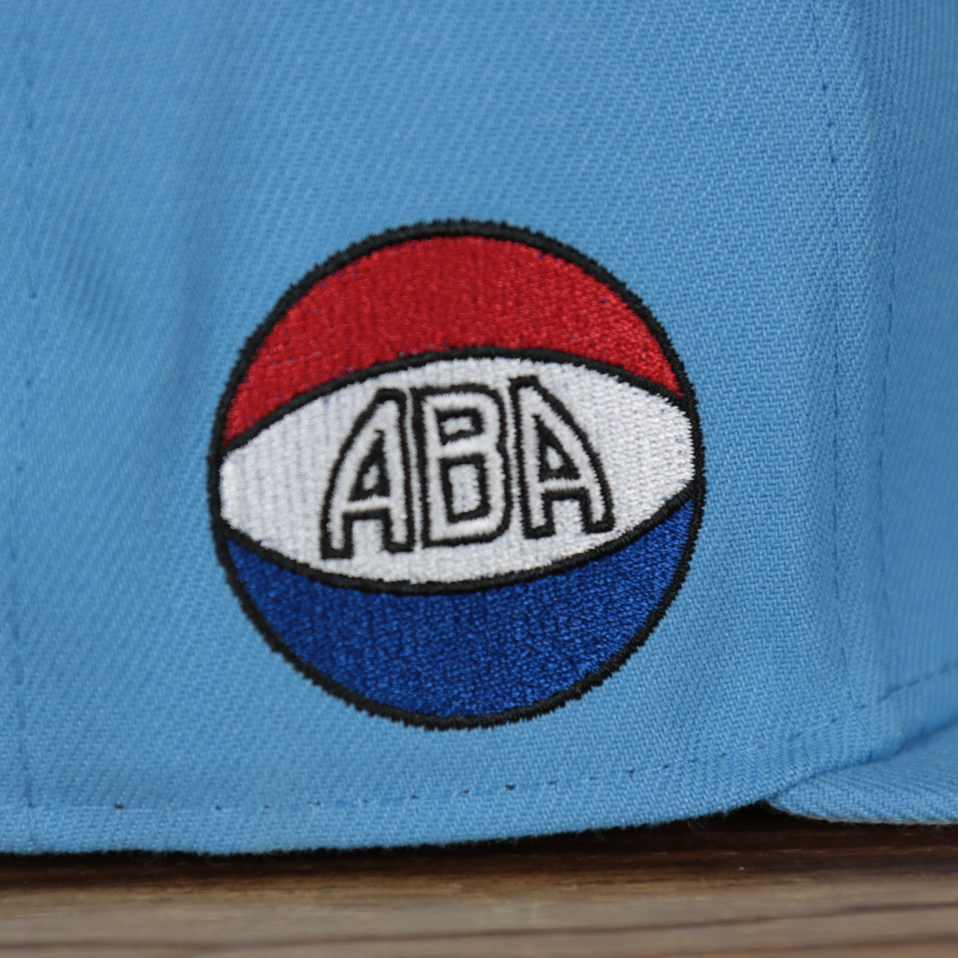 aba logo on the Denver Nuggets 2021 City Edition Vintage Grey Bottom 9Fifty Snapback | Light Blue