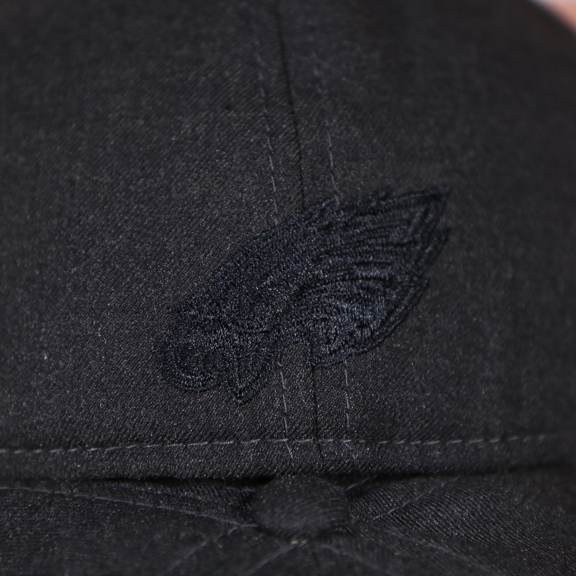 Eagles logo on the backside of the Philadelphia Eagles Jeff Cap Black Duckbill Hat | OSFM