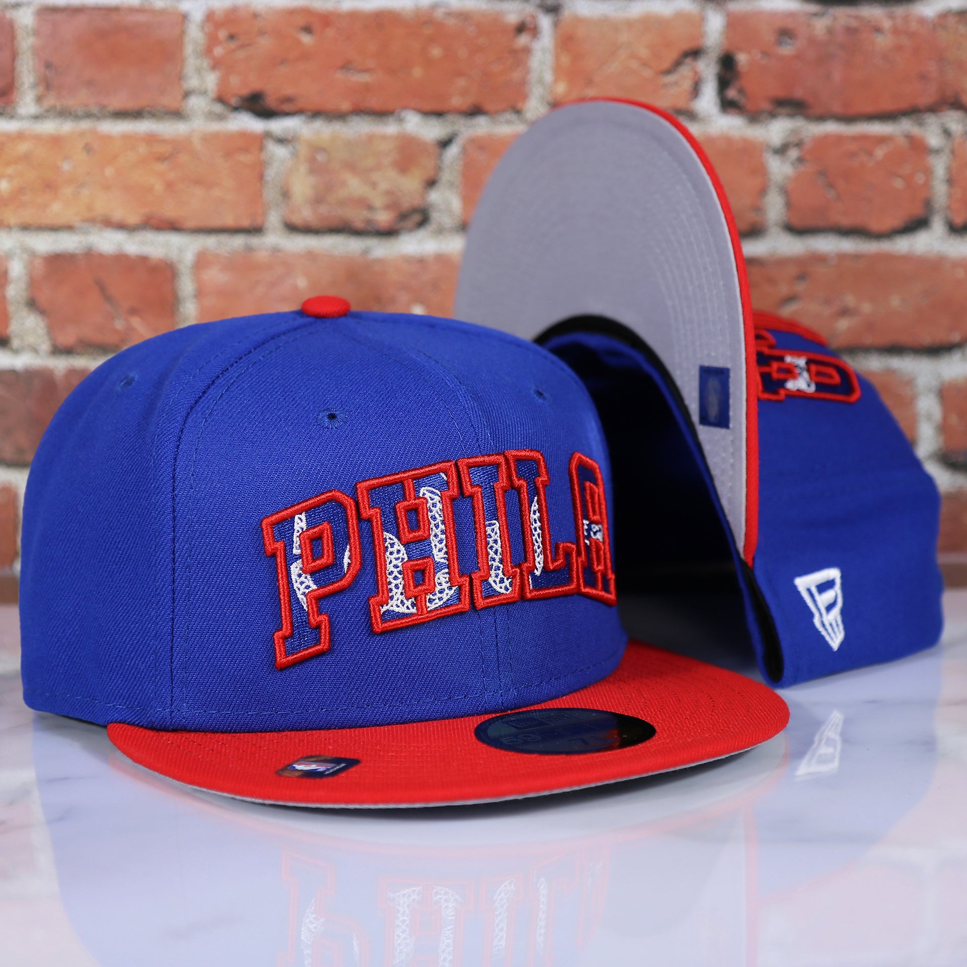 front and bottom of the Philadelphia 76ers 2021 NBA Draft 59Fifty Fitted Cap | Blue/Red