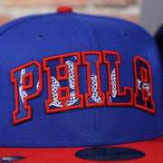 draft logo on the front of the Philadelphia 76ers 2021 NBA Draft 59Fifty Fitted Cap | Blue/Red