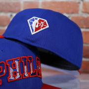 NBA 75 logo on the backside of the Philadelphia 76ers 2021 NBA Draft 59Fifty Fitted Cap | Blue/Red