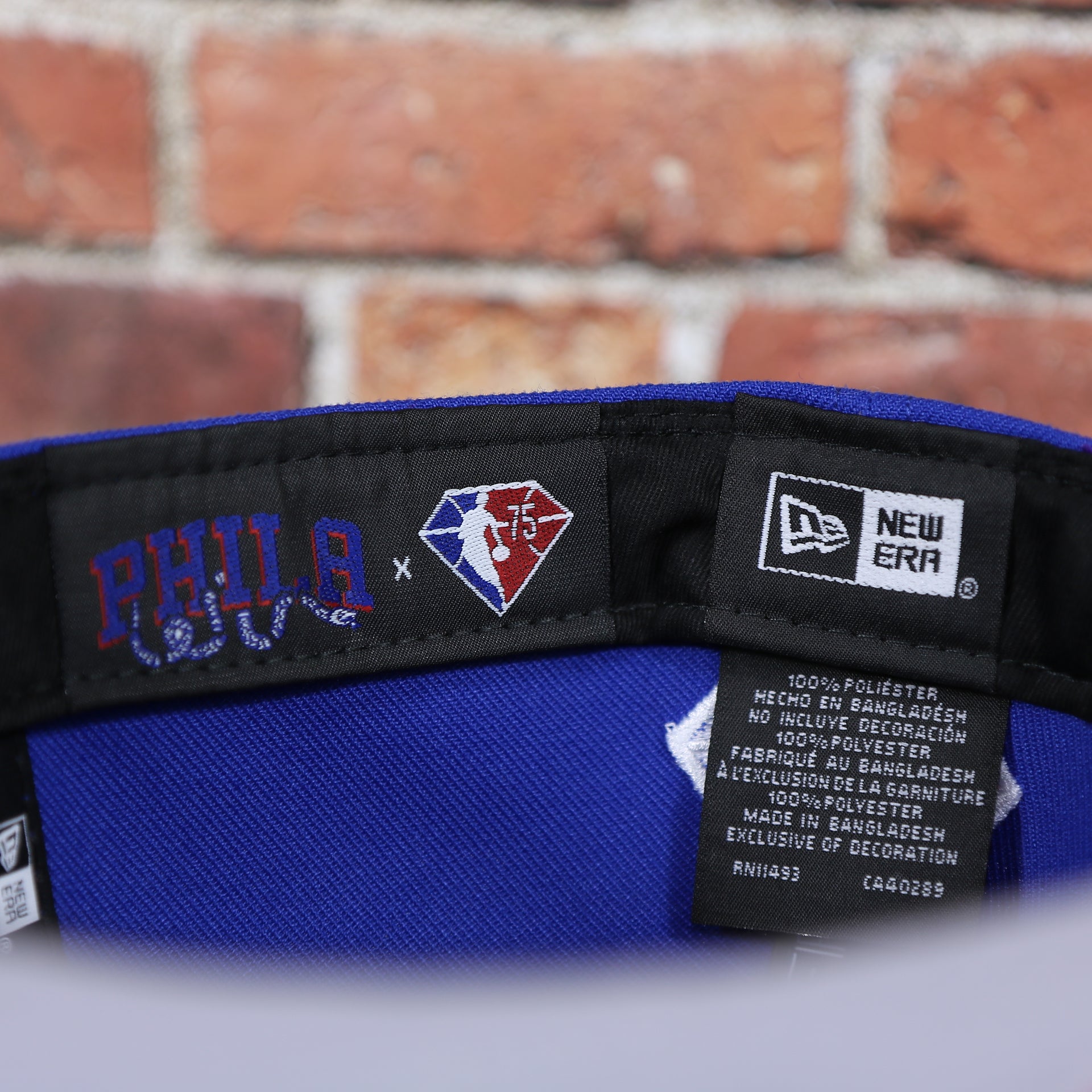 new era tag and PHILA tag on the inside of the Philadelphia 76ers 2021 NBA Draft 59Fifty Fitted Cap | Blue/Red