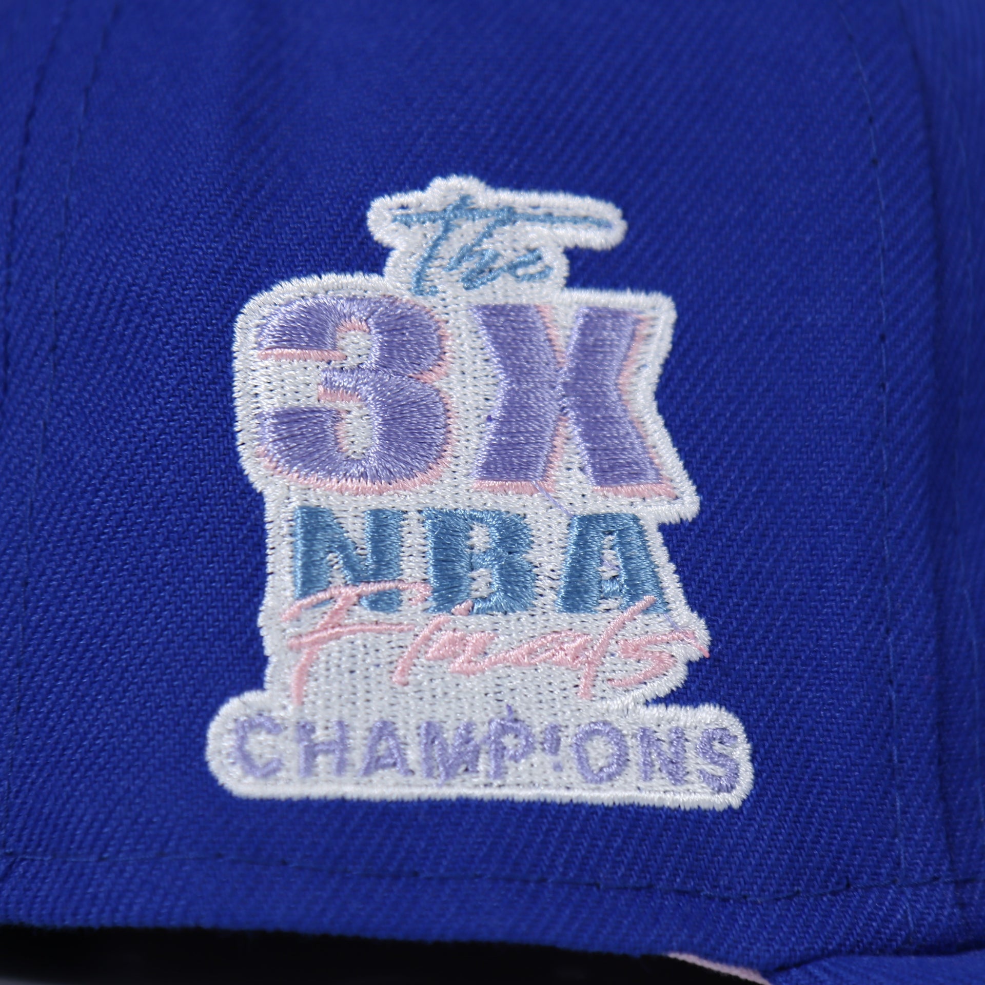 3X NBA champions side patch on the Philadelphia 76ers Pop Sweat Pastel NBA Finals Champions Side Patch Fitted Cap With Pink Undervisor | Royal Blue 59Fifty Cap