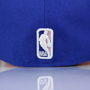NBA logo on the Philadelphia 76ers Pop Sweat Pastel NBA Finals Champions Side Patch Fitted Cap With Pink Undervisor | Royal Blue 59Fifty Cap