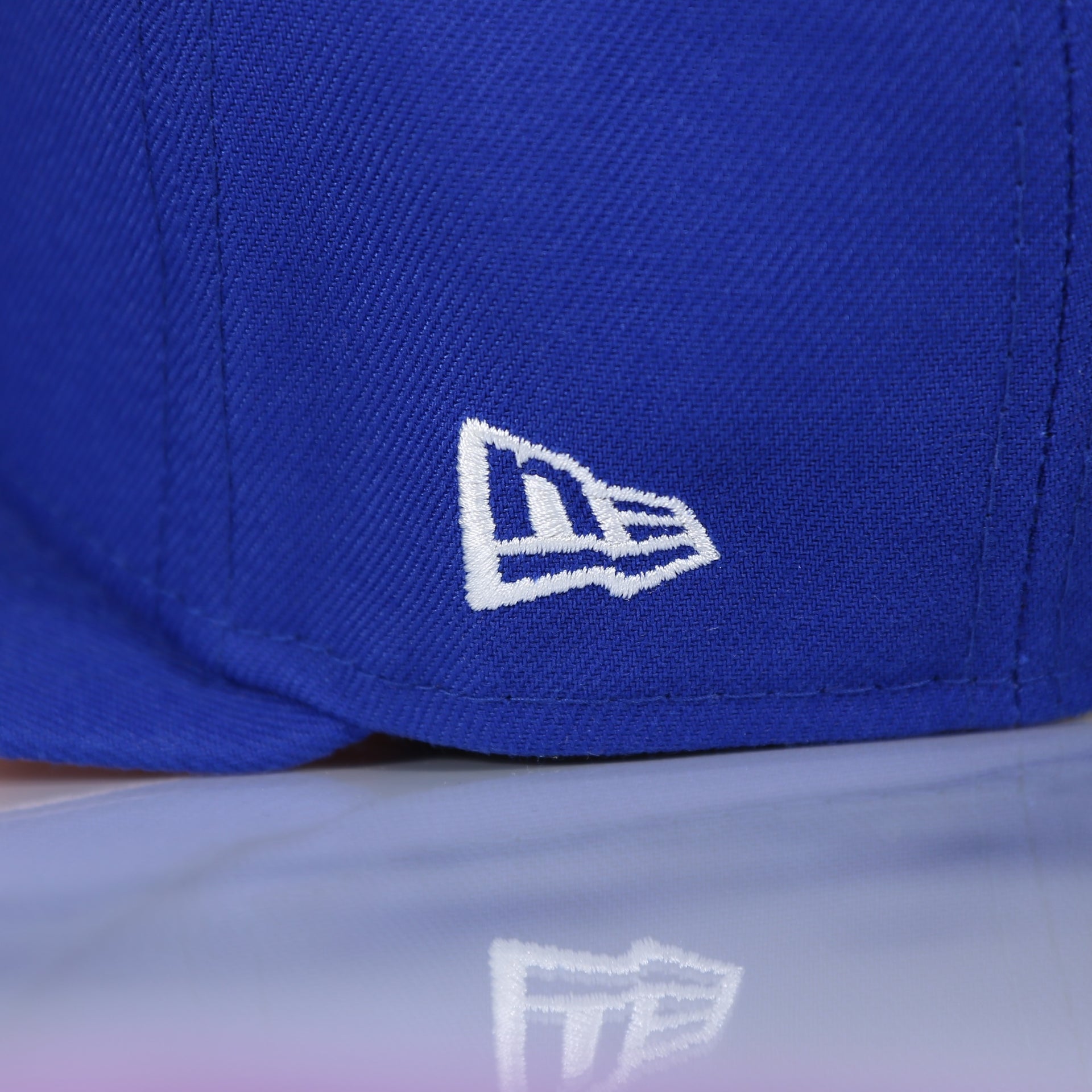new era logo on the Philadelphia 76ers Pop Sweat Pastel NBA Finals Champions Side Patch Fitted Cap With Pink Undervisor | Royal Blue 59Fifty Cap