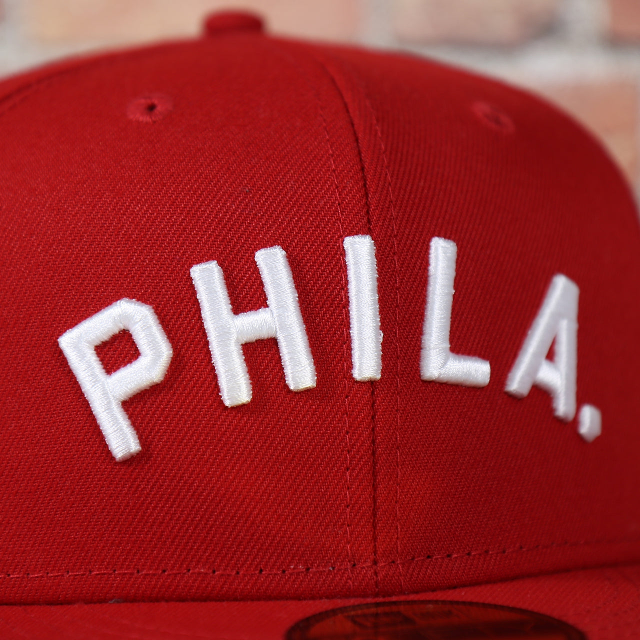 phila lettering on the Philadelphia Phillies Arched "PHILA" Lettering 59Fifty Fitted Cap | Old School Phillies Red Bottom New Era Fitted Hat