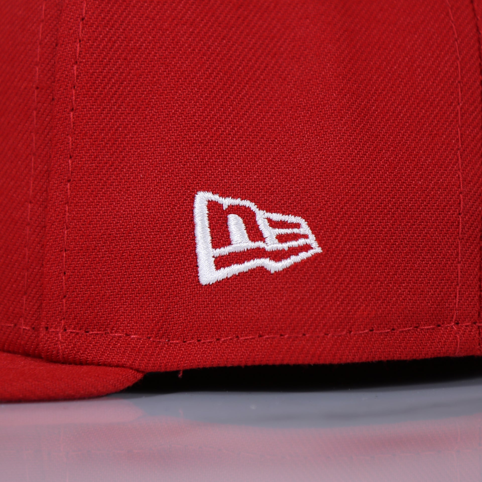 new era logo on the Philadelphia Phillies Arched "PHILA" Lettering 59Fifty Fitted Cap | Old School Phillies Red Bottom New Era Fitted Hat