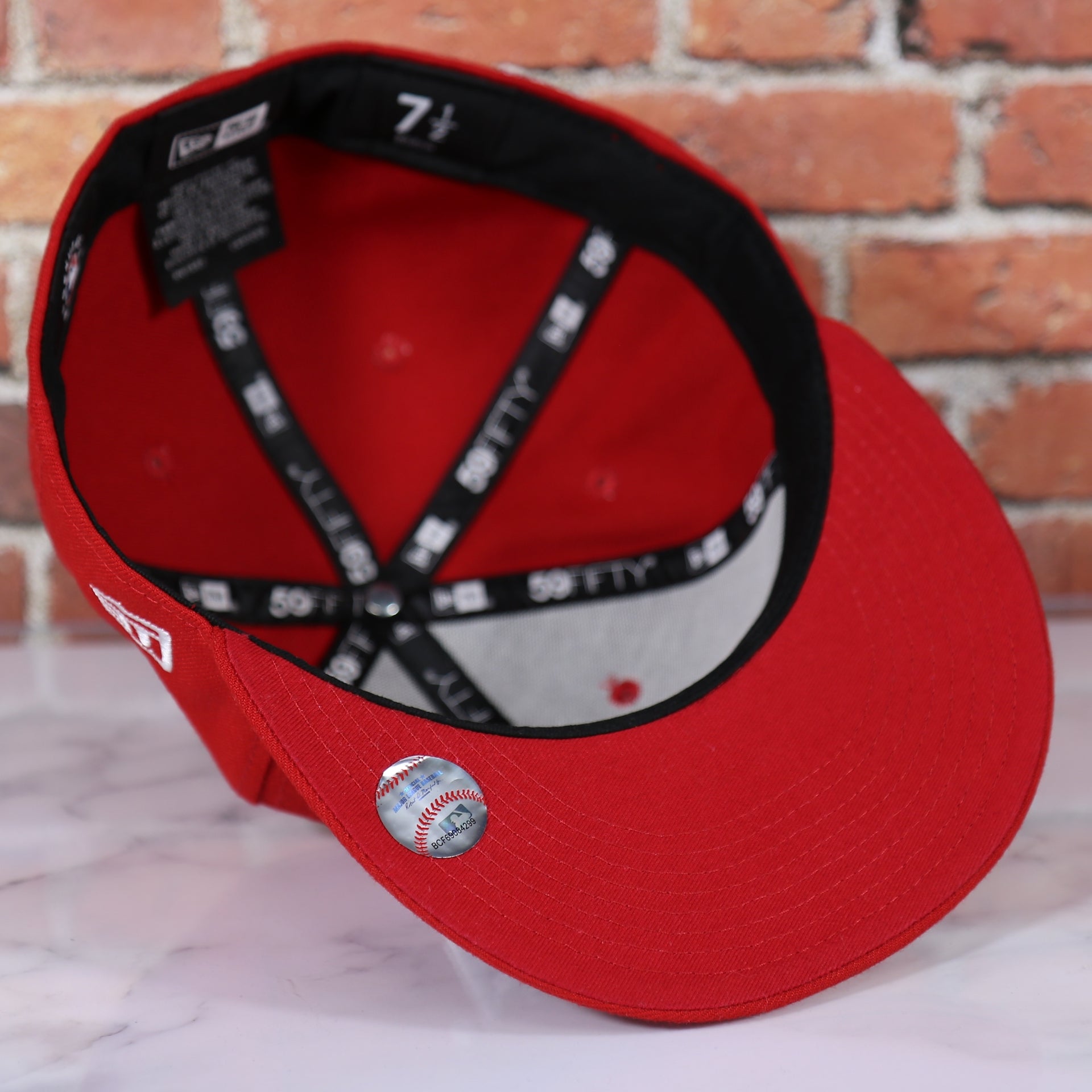 red under visor on the Philadelphia Phillies Arched "PHILA" Lettering 59Fifty Fitted Cap | Old School Phillies Red Bottom New Era Fitted Hat