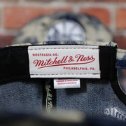mitchell and ness label on the Golden State Warriors Acid Wash Denim Dad Hat | 9Twenty San Francisco Baseball Cap