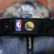 NBA label on the Golden State Warriors Acid Wash Denim Dad Hat | 9Twenty San Francisco Baseball Cap
