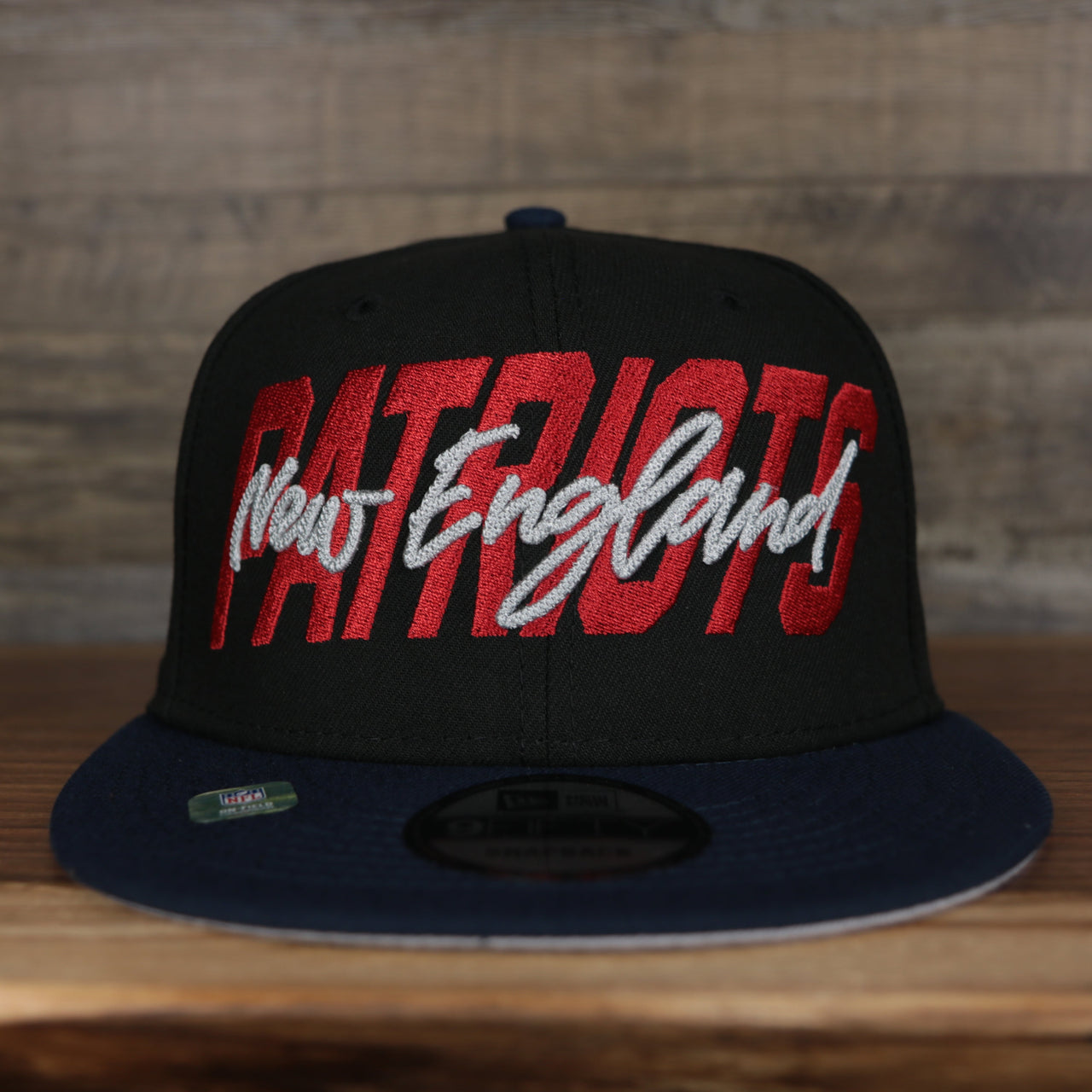 front of the  New England Patriots 2022 NFL Draft 9Fifty Grey Bottom On-Field Snapback | Black