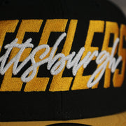 logo shot of the Pittsburgh Steelers 2022 NFL Draft 9Fifty Grey Bottom On-Field Snapback | Black