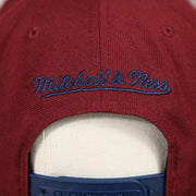 mitchell and ness logo on the Cleveland Cavaliers Reflective Lettering Maroon Snapback Hat