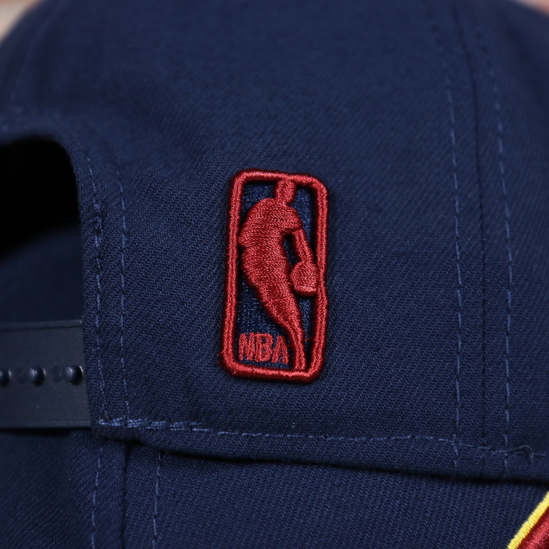 NBA logo on the Cleveland Cavaliers Classic Navy Blue Snapback Hat