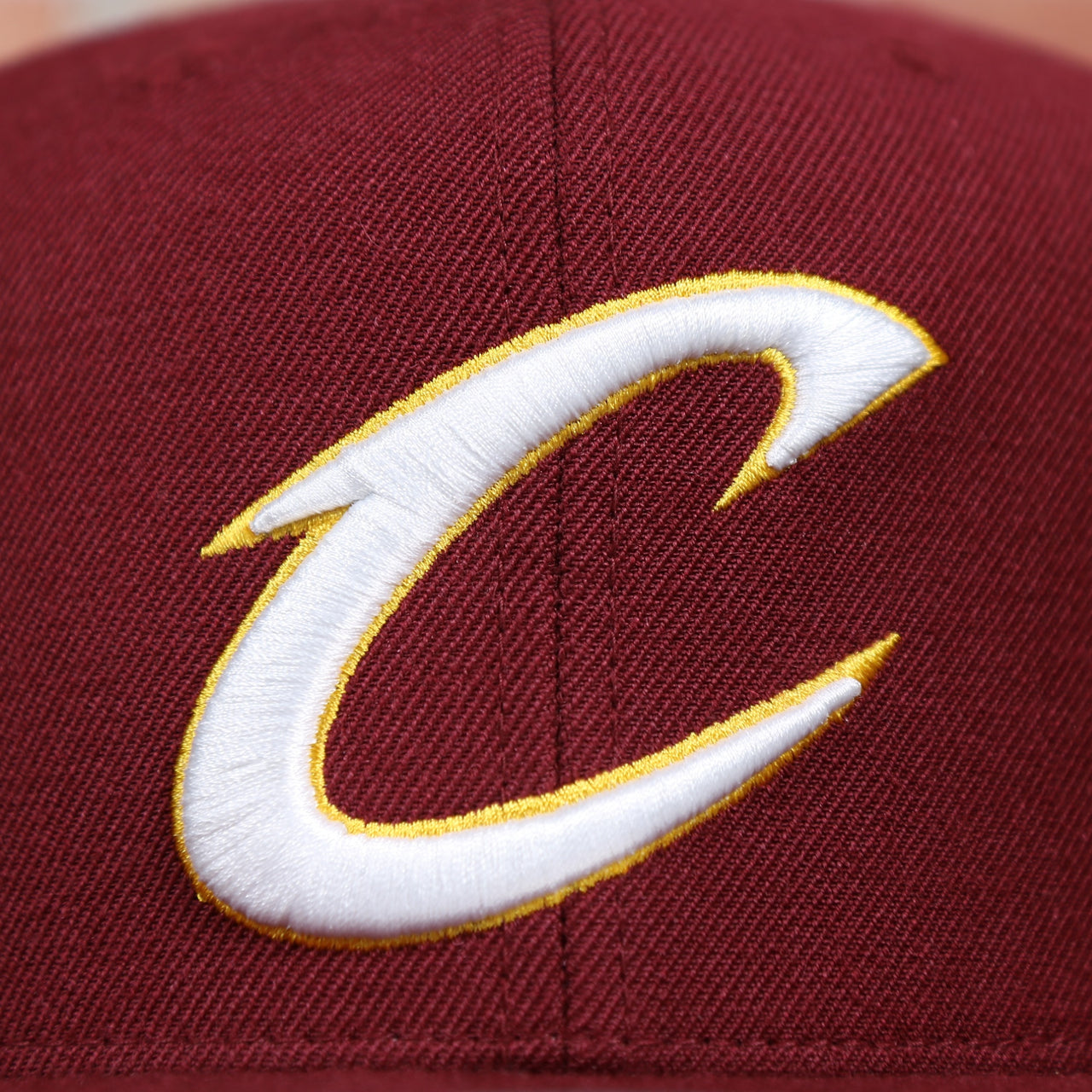 cavaliers  logo on the Cleveland Cavaliers Classic Maroon Snapback Hat