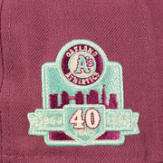 Close up of the 40th anniversary patch on the Philadelphia Athletics Glow In The Dark Oakland 40 Year Patch Teal Bottom Side Patch 59Fifty Fitted Cap
