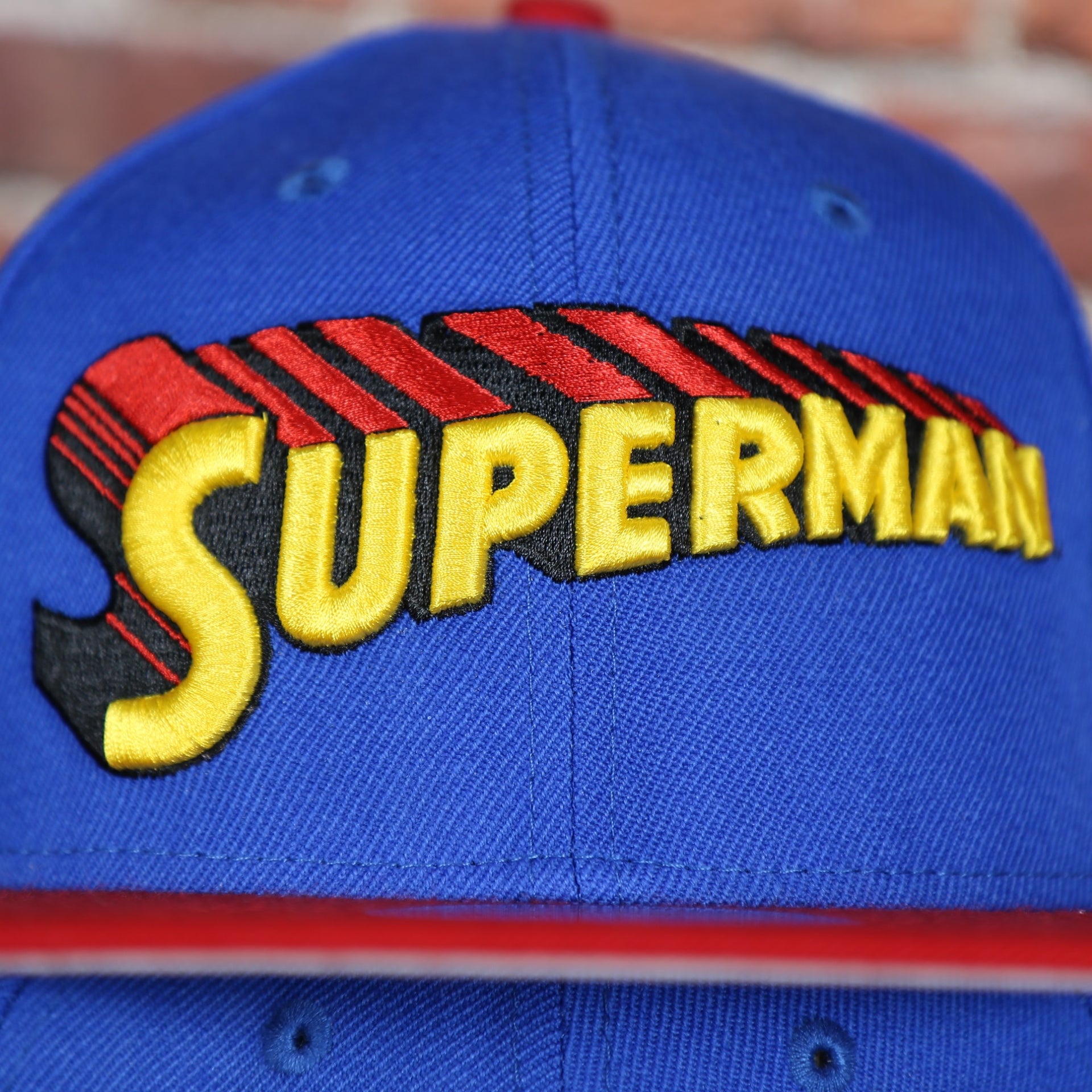 superman logo on the Superman Vintage Lettering DC Comics Blue on Red Custom 950 Snapback Hat