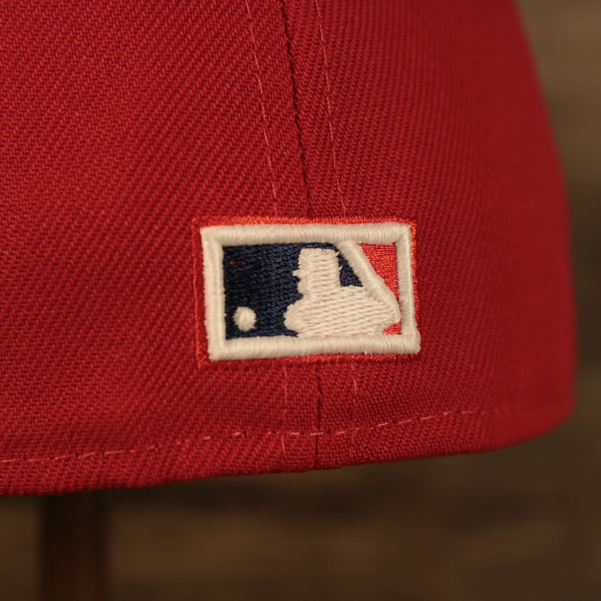 Close up of the MLB Batterman logo in Philadelphia Phillies Glow In The Dark 100th Anniversary Teal Bottom Side Patch 59Fifty Fitted Cap