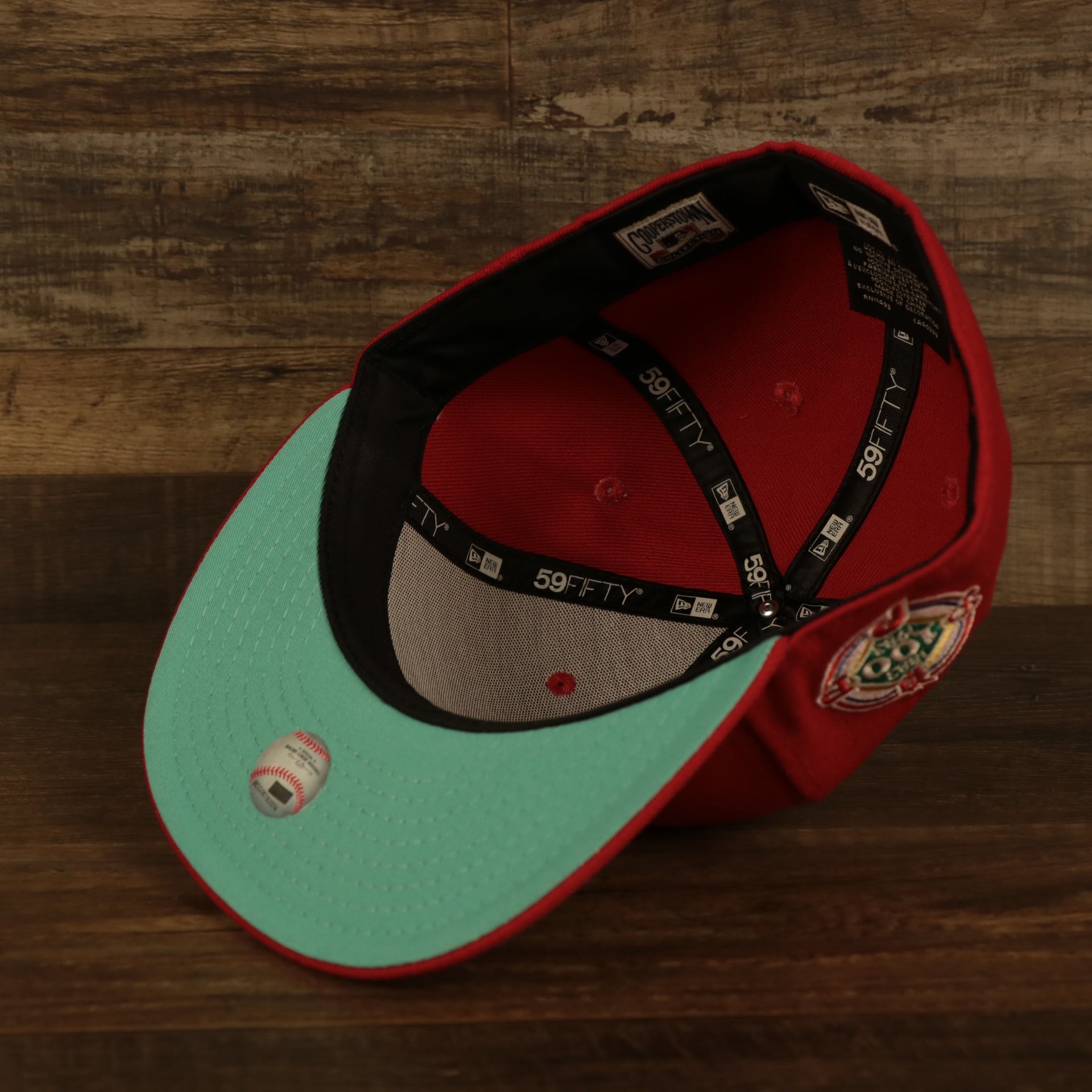Teal bottom of the Philadelphia Phillies Glow In The Dark 100th Anniversary Teal Bottom Side Patch 59Fifty Fitted Cap