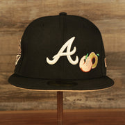 Front of the Atlanta Braves Glow In The Dark 1995 World Series Peach Bottom 59Fifty Side Patch Fitted Cap