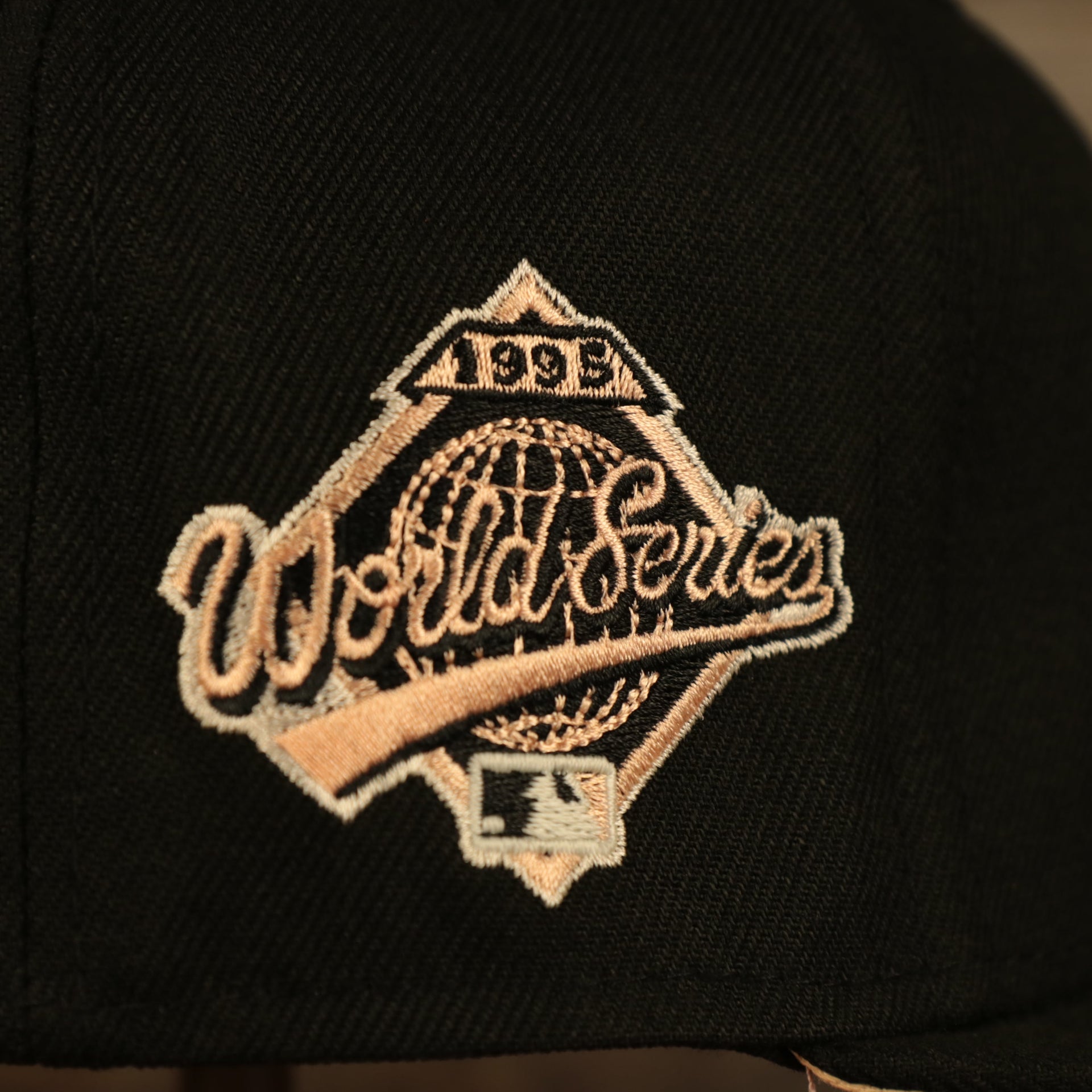Close up of the 1995 World Series side patch on the Atlanta Braves Glow In The Dark 1995 World Series Peach Bottom 59Fifty Side Patch Fitted Cap