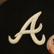 Close up of the Glow in the dark Braves logo on the Atlanta Braves Glow In The Dark 1995 World Series Peach Bottom 59Fifty Side Patch Fitted Cap