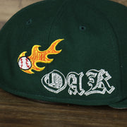 A close up of the side patches on the Oakland Athletics “Scribble” Side Patch Gray Bottom 59Fifty Fitted Cap