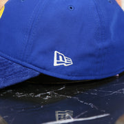 new era  logo on the Golden State Warriors NBA Draft 9Twenty Dad Hat With Suede Visor | Royal Blue Baseball Hat