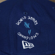 A close up of the World series 7 champions side patch on the Los Angeles Dodgers “Scribble” Side Patch Gray Bottom 59Fifty Fitted Cap
