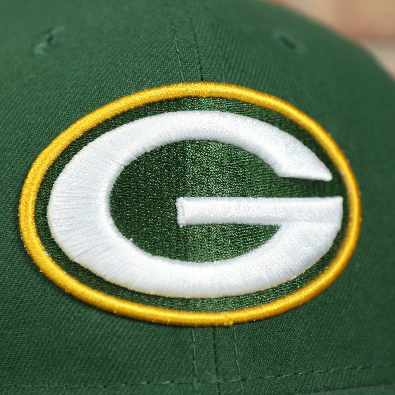packers logo on the Green Bay Packers Four Time Super Bowl Champions Side Patch 59Fifty Fitted Cap | Green Fitted Cap