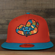 front view of the Wisconsin Timber Rattlers 2022 Cascabeles de Wisconsin Copa On-Field Black Bottom 5950 Fitted Cap | Orange