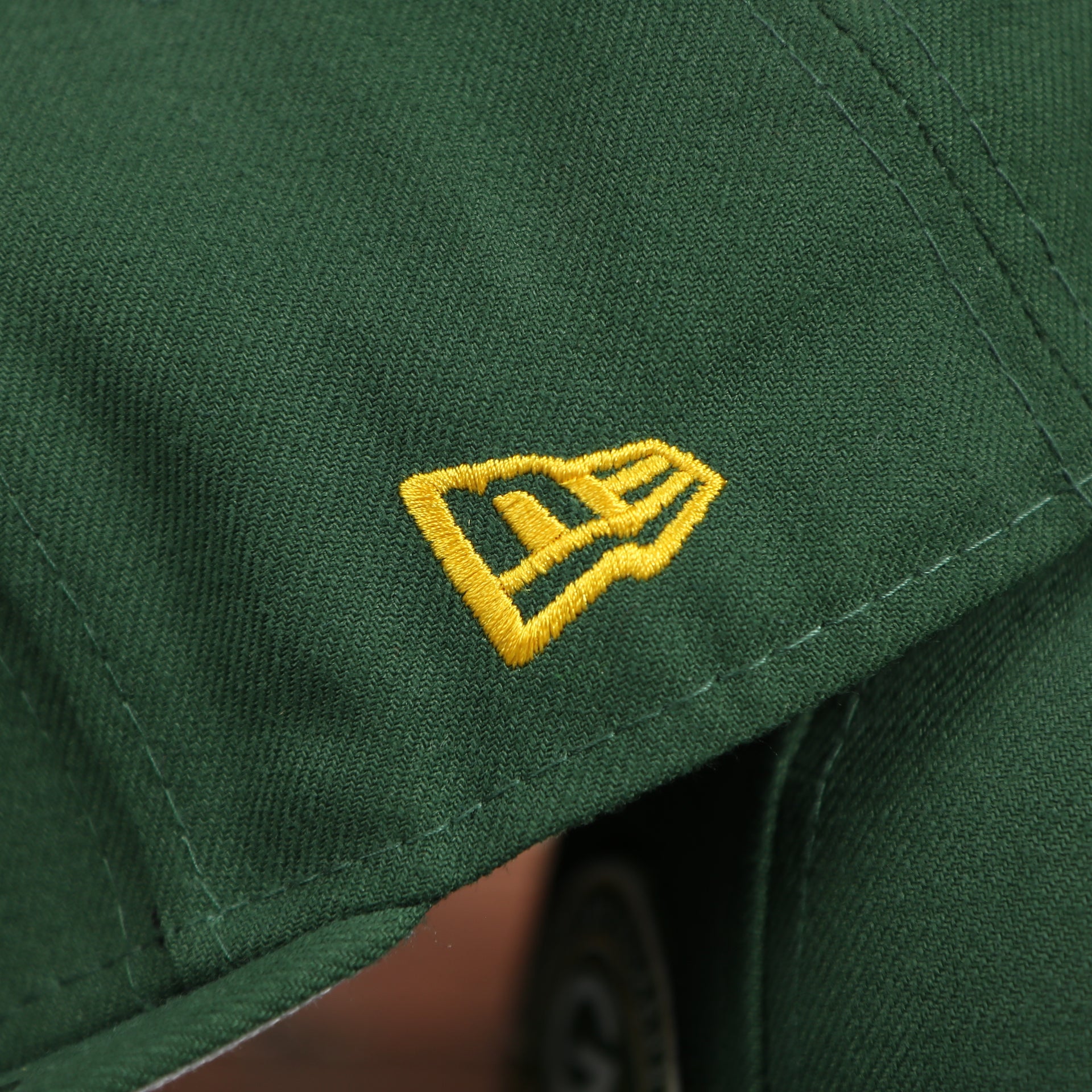new era logo on the Green Bay Packers Four Time Super Bowl Champions Side Patch 59Fifty Fitted Cap | Green Fitted Cap