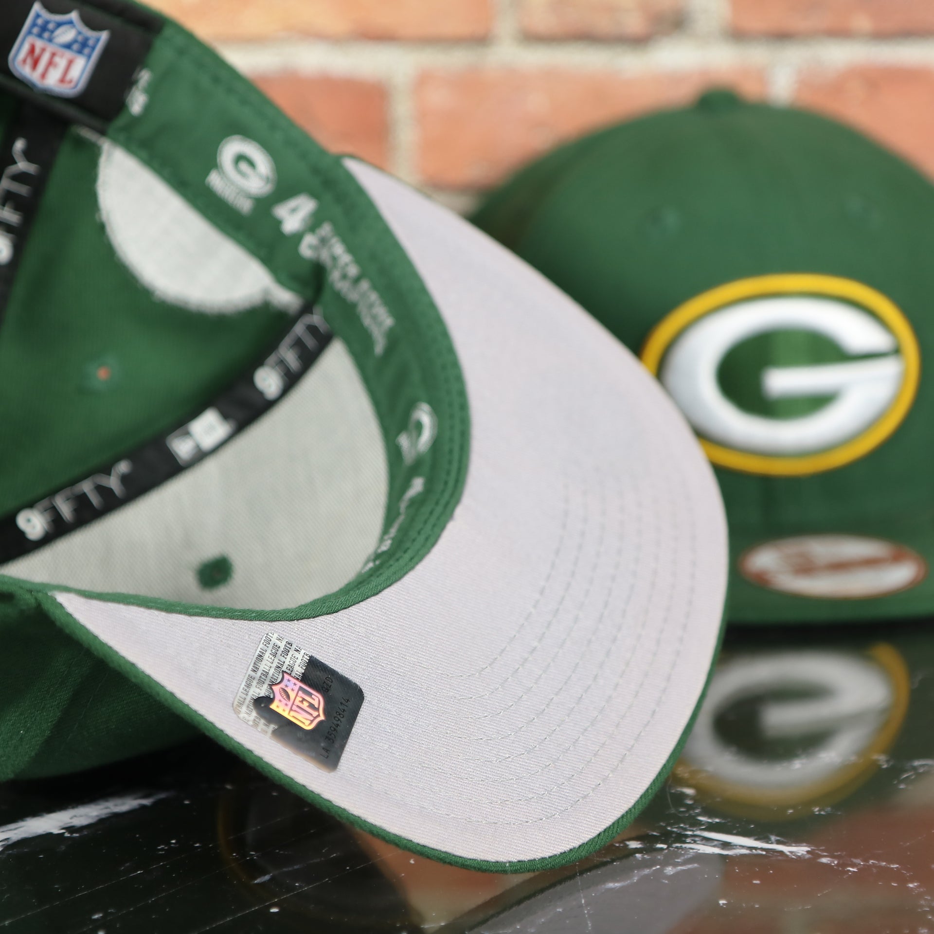 grey under visor on the Green Bay Packers Four Time Super Bowl Champions Side Patch 59Fifty Fitted Cap | Green Fitted Cap