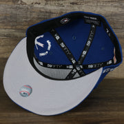 The gray under visor on the New York Mets “Scribble” Side Patch Gray Bottom 59Fifty Fitted Cap