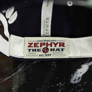 zephyr label on the BYU Cougars Green Bottom Arched Wordmark Snapback Cap | Navy Blue Snap Cap