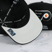 Grey under visor of the Philadelphia Flyers No Shot Grey Undervisor Black Snapback Hat
