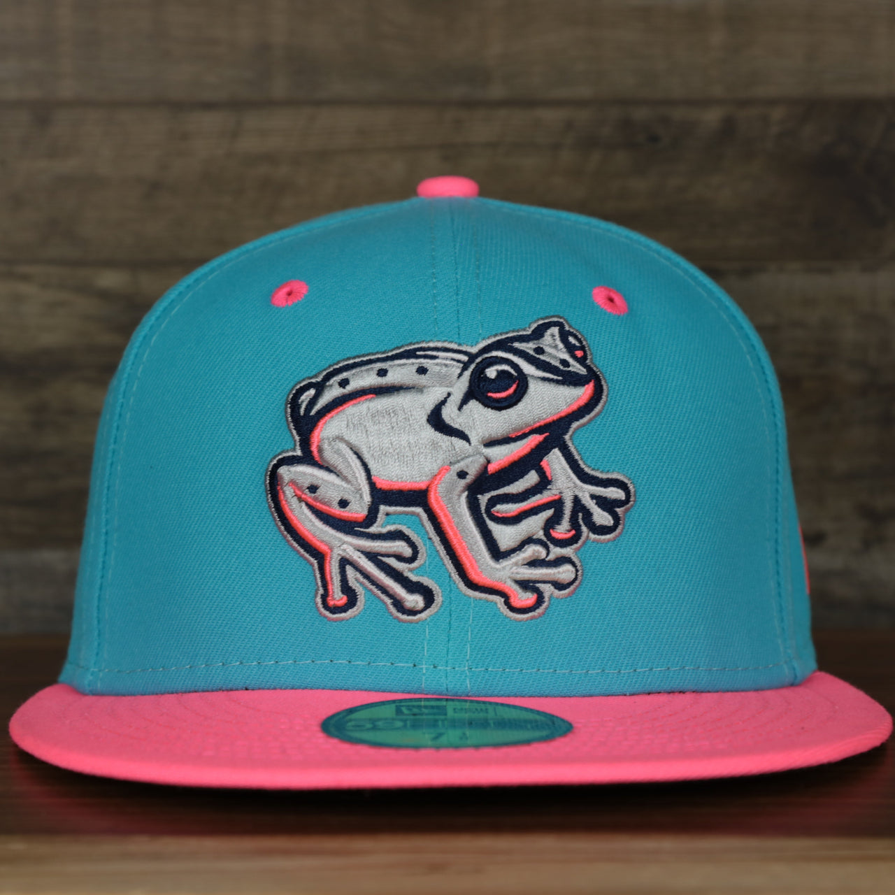 front of the Leigh Valley Iron Pigs 2022 Coquis de Leigh Valley Copa de la Diversion On-Field Black Bottom 5950 Fitted Cap | Blue/Pink