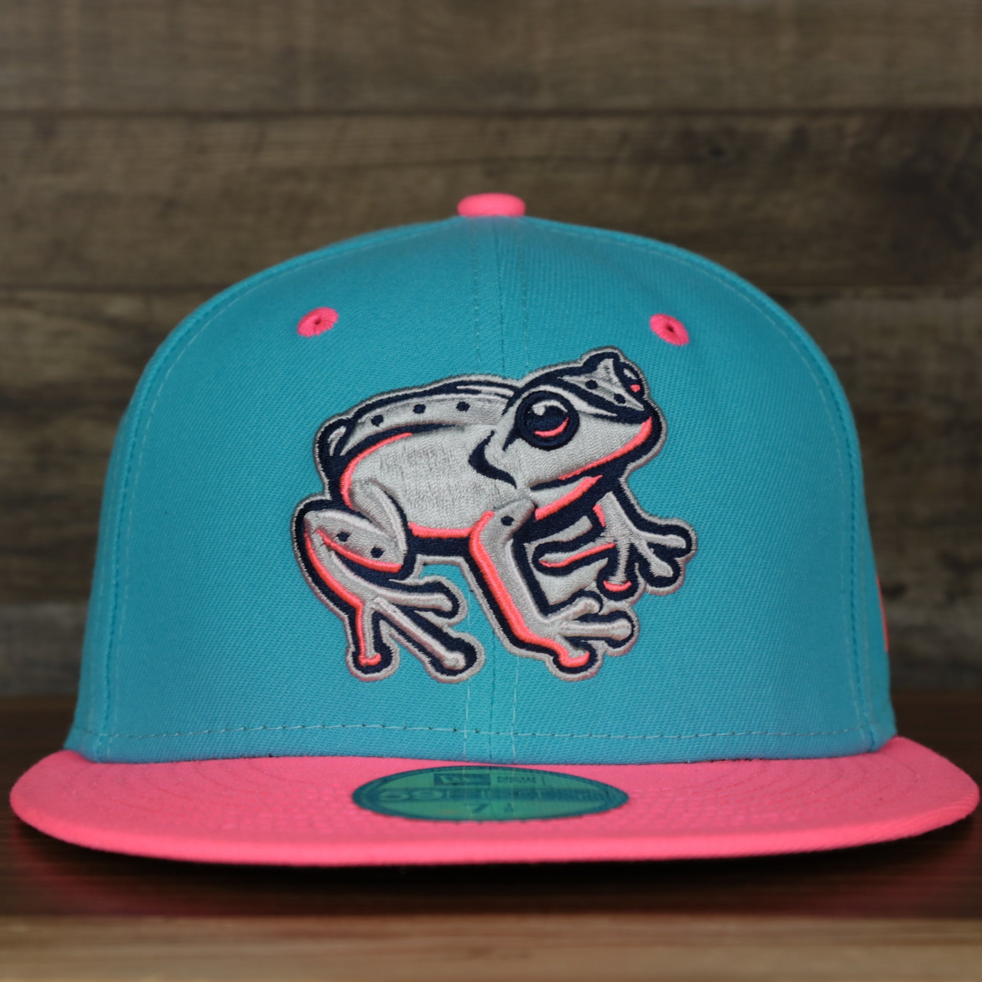 front of the Leigh Valley Iron Pigs 2022 Coquis de Leigh Valley Copa de la Diversion On-Field Black Bottom 5950 Fitted Cap | Blue/Pink