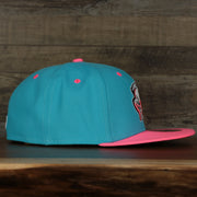 wearers right on the Leigh Valley Iron Pigs 2022 Coquis de Leigh Valley Copa de la Diversion On-Field Black Bottom 5950 Fitted Cap | Blue/Pink