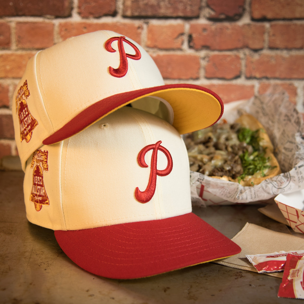 front of the Philadelphia Phillies Cooperstown 1952 All Star Side Patch Yellow UV 59Fifty Fitted Cap | Chrome/Red | CheeseSteak Pack Cap Swag Exclusive