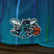 hornets logo on the Charlotte Hornets 2021 Retro City Edition Gray Bottom 9Fifty Snapback | Blue