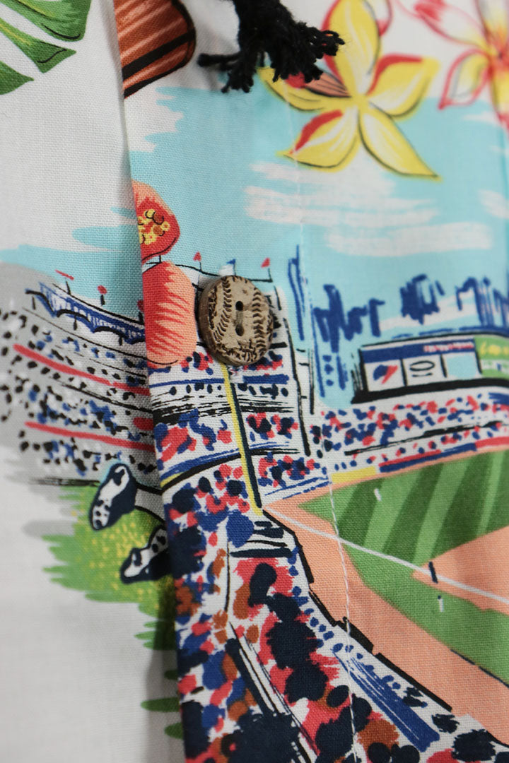 A close up of the wooden Buttons on the New York Yankees Authentic Hawaiian Print Polo Shirt | Scenic
