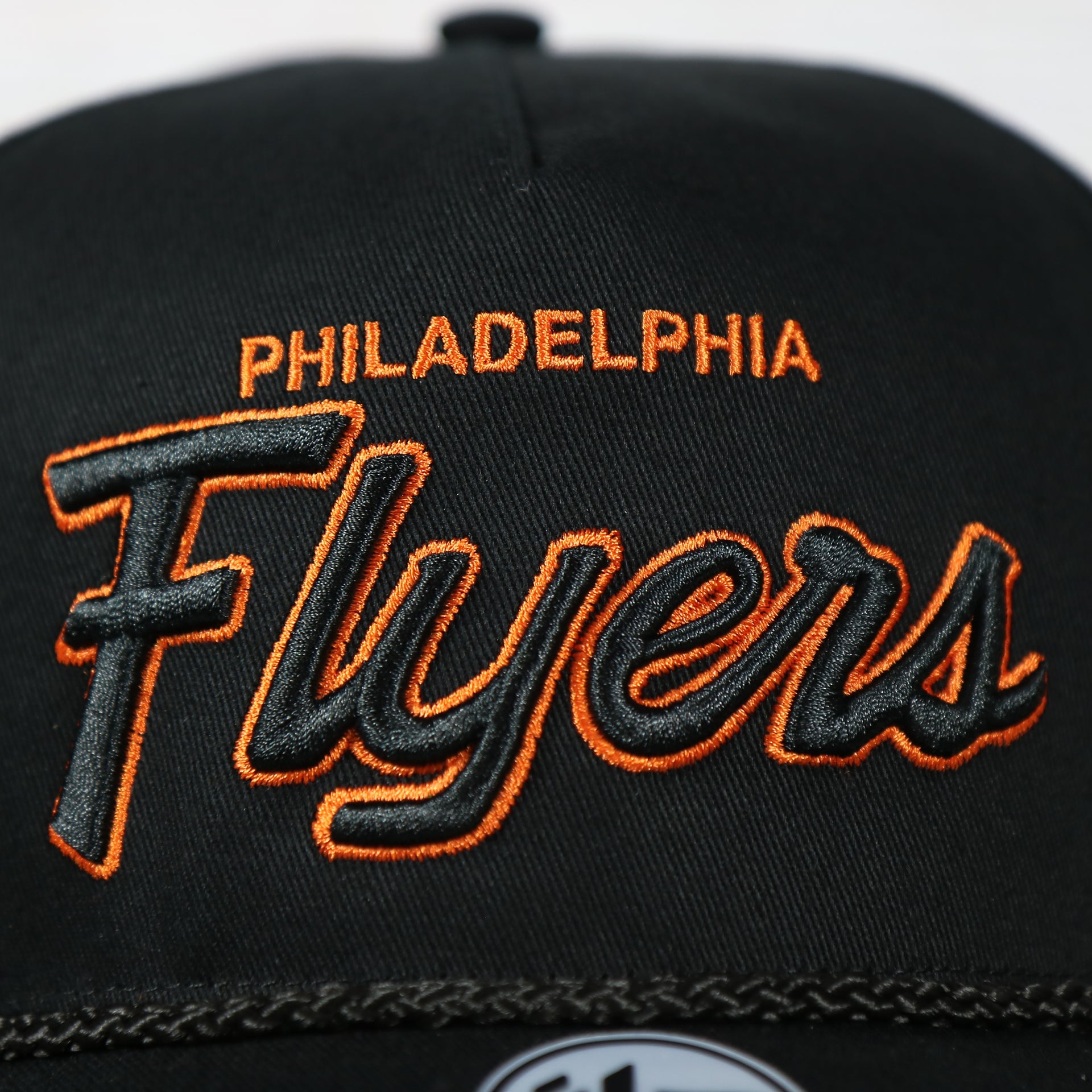 logo on the front of the Philadelphia Flyers Black Snapback Dad Hat | Black Adjustable Baseball Cap