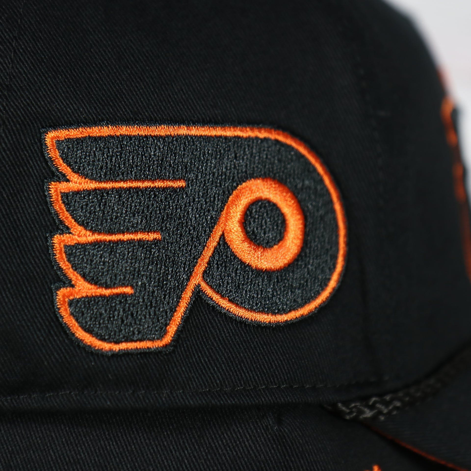 flyers logo on the side of the Philadelphia Flyers Black Snapback Dad Hat | Black Adjustable Baseball Cap