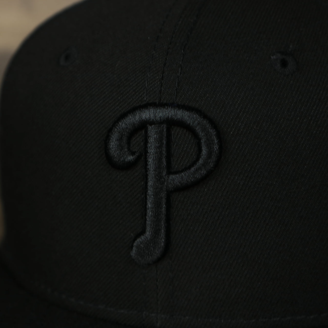 A close up of the logo on the Philadelphia Phillies New Era Tonal 9Fifty Snapback