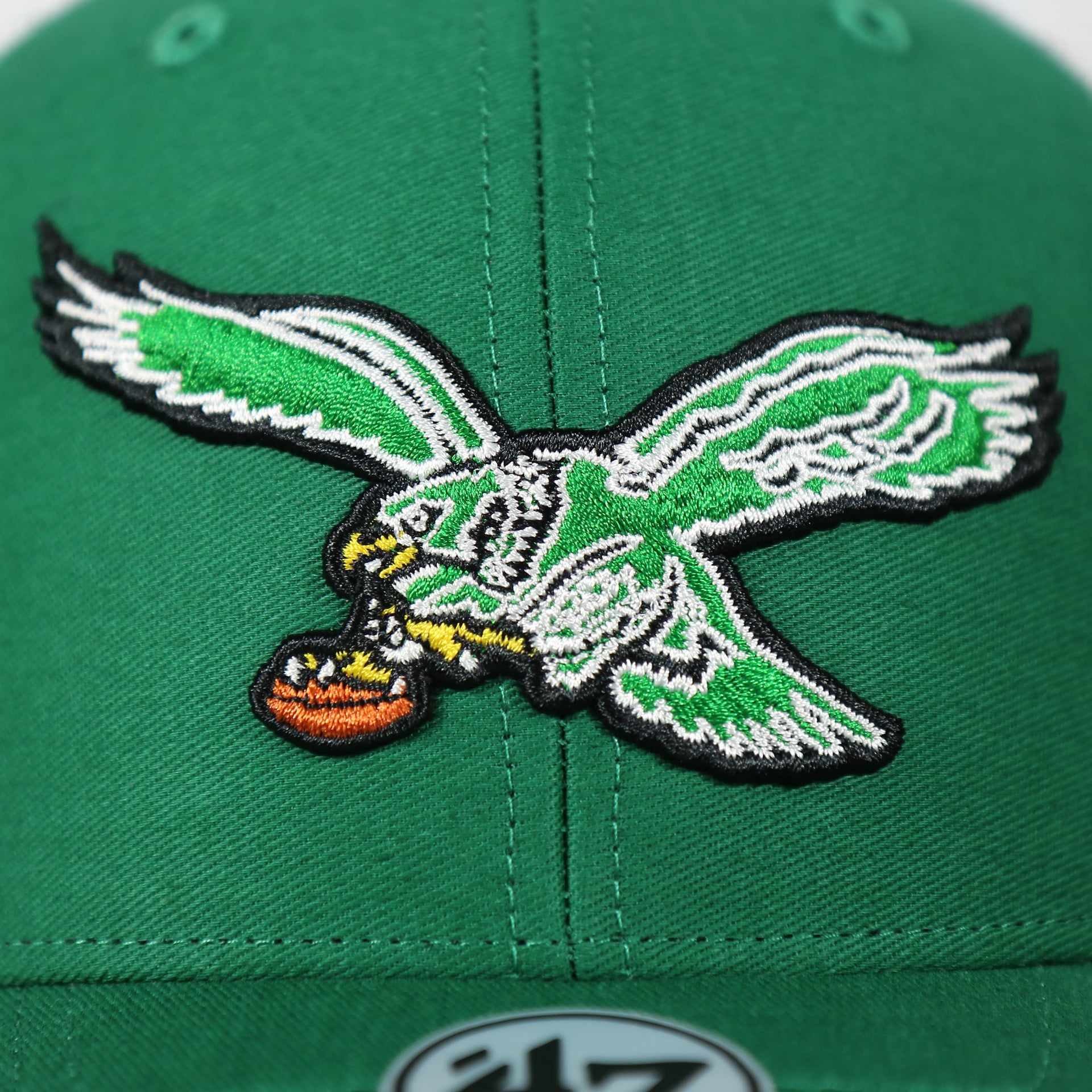 eagles logo on the Philadelphia Eagles Throwback Mesh Back Trucker Hat | Kelly Green Trucker Hat
