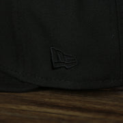 A close up of the New Era logo on the Philadelphia 76ers New Era Tonal 9Fifty Snapback