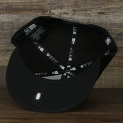 The underside of the Philadelphia 76ers New Era Tonal 9Fifty Snapback